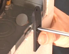 Push down on the handle to lift up the knockout - it can now be easily removed.